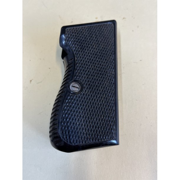 Grips in plastic, complete with screw, in a very good condition