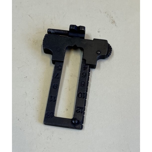 Sliding safety, scale and pin f. sight (rifle)